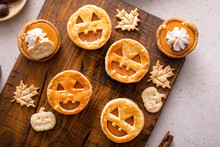 Mini Pumpkin Pies With Jack O Lanterns Decoration