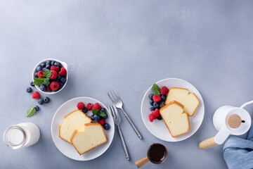 Wall Mural - Classic pound cake sliced served with fresh berries