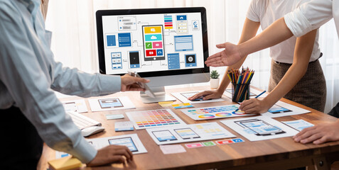 Aufkleber - Panorama shot of front-end developer team brainstorming UI and UX designs for mobile app on laptop computer screen. User interface development team planning for user-friendly UI design. Scrutinize