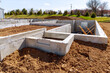 © Victor - concrete foundation with reinforcement and metal slab construction site, process of house building