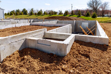 concrete foundation with reinforcement and metal slab construction site, process of house building