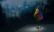 A small New Caledonia flag on an abstract blurry background