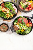 Fototapeta  - Healthy vegetarian and vegan  salads and Buddha Bowls with vitamins, antioxidants, protein on light  background.