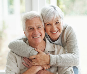 Canvas Print - Portrait, smile and senior couple with love, hug and romance with retirement, relationship and bonding. Face, happy mature woman and elderly man embrace, home and marriage with commitment and loving