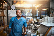 © Donson/peopleimages.com - Coffee shop, barista and happy black man in restaurant for service, working and thinking in cafe. Small business owner, bistro startup and male entrepreneur smile in cafeteria counter ready to serve
