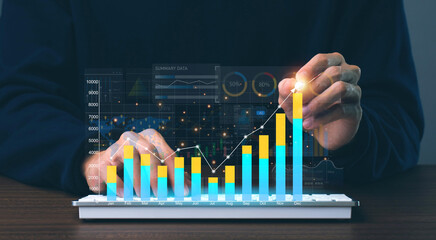 Fototapete - Businessman using tablet analyze sales data and economic growth graph chart and report with KPI and metrics connected to the database. Business planning and strategy.Technology digital marketing.
