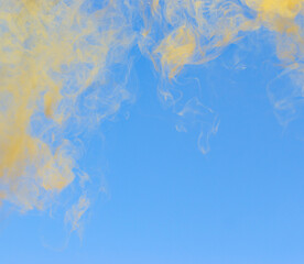 yellow smoke on blue background