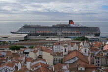 Luxury Ocean Liner Cruiseship Cruise Ship Victoria Or Elizabeth In Port Of Lisbon, Portugal During Mediterranean Cruising With City Skyline