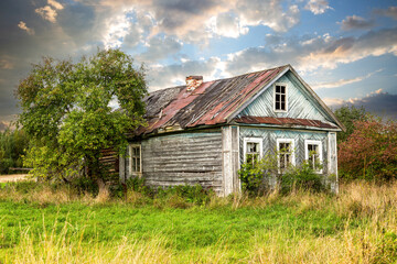 Wall Mural - Old abandoned rural wooden house in russian village in summer sunny day