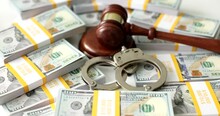 Judge Gavel Handcuffs And Banknotes Concept. Economic Crime Concept Of Collateral Fraud And Corruption
