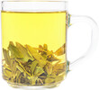Tea brewing in transparent glass cup. Dragon Well green tea (Longjing tea).