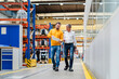 © Westend61 - Businessmen having discussion and walking in factory