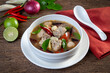 Spicy spare rib pork and straw mushroom,Fiery Pork Ribs Broth in white bowl.asian food