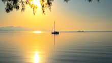 Early Morning On Calm Sea, Orange Sky And Sailing Yacht, Calmness, Serenity And Meditation