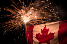 Canada Day Fireworks Explode Behind A Canadian Flag. Generative AI