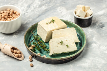 Canvas Print - soy cheese tofu diced on a light background, Healthy vegan meatless meal rich in protein and calcium. Food recipe background. Close up