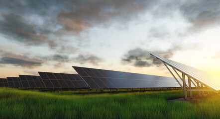rows of solar panels at sunset in a field against the backdrop of green grass. ground power plant of