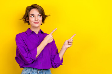Aufkleber - Photo of young consultant woman wear violet shirt direct fingers empty space tips for your business isolated on yellow color background