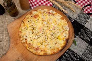 Brazilian pizza with mushroom, cheese and oregano