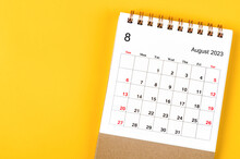A August 2023 Monthly Desk Calendar For 2023 Year On Yellow Background.