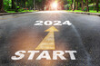 Start to 2024  written on the road on nature background with sunlight. Business planning concept and new year beginning success idea