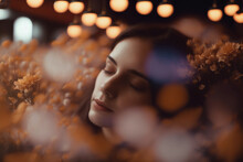 Generative AI Illustration Of Selective Focus Of Female Model With Eyes Closed Surrounded With Orange And White Blooming Flowers Against Electric Lights Enjoying Smell