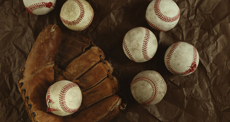 Canvas Print - Vintage style baseball banner with used game balls on old glove background.
