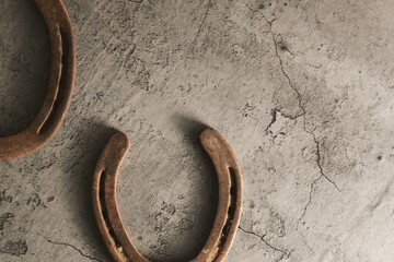 Poster - Old rustic western background with rough texture of used horseshoes and copy space.