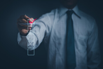 Poster - businessman holding a pen check mark red In the checkbox, checklist concept document verification, approve or answering questionnaires