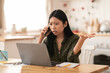 © Prostock-studio - Angry asian businesswoman fighting with assistant on phone