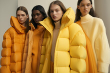 Four Models Wearing Yellow Jackets