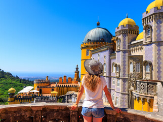 Wall Mural - tour tourism in sintra- woman tourist enjoying view of pena castle