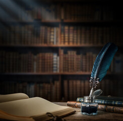 Wall Mural - Old quill pen with an inkwell, papers and books on a table against an old bookshelf. Concept on the theme of history, education, literature. Retro style.