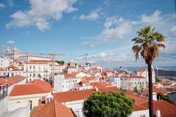 Sticker - Beutiful view of old town in Lisbon. Red tiled roofs and blue sky.