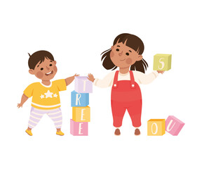 Sticker - Happy girl and boy playing toy blocks. Joyful kids brother and sister playing together cartoon vector illustration