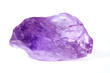Amethyst. A raw amethyst nugget on a white background. Amethyst is a variety of quartz. Amethyst is purple in color. It is a semi-precious stone.