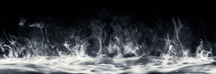 Wall Mural - real smoke swirling upwards. dramatic smoke or fog effect for spooky halloween or other dramatic bac