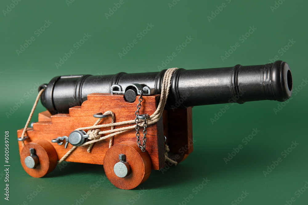Toy model of cannon on green background