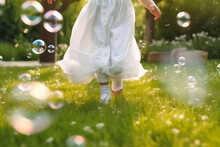 A Close - Up Of Big Bubbles, Blurred Background Of A Child's Legs Wearing White Clothes And Running Around On The Lawn. AI Generative