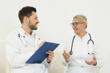 Sticker - Professional doctors having discussion in office hall