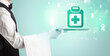 © ra2 studio - Handsome young waiter in tuxedo holding healthcare icons on tray