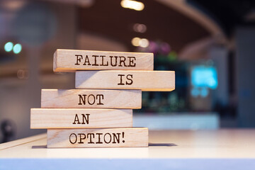 Wooden blocks with words 'Failure is not an option'. Inspirational motivational quote