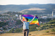 Young woman with LGBT flag.