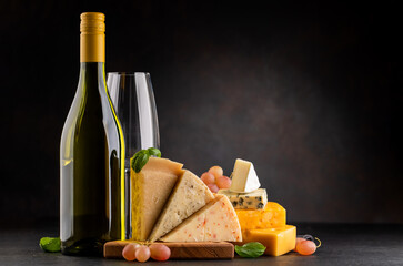 Wall Mural - Various cheese on board and white wine