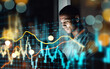 © Angelo/peopleimages.com - Businessman, tablet and dashboard at night of stock market, trading or graph and chart data at office. Man trader or broker working late on technology checking digital trends, analytics or statistics