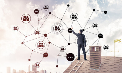 businessman on house roof presenting networking and connection c