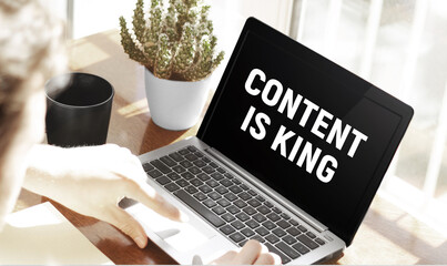 Poster - Businessman typing text Content is king in laptop on office background