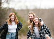 © Cavan Images - Three beautiful teen girls having fun together outdoors.