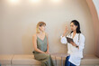 © Cavan Images - Female doctor with tablet PC explaining to patient in clinic