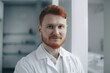 © Cavan Images - Young redhead male scientific in laboratory. Generative AI., Generative AI